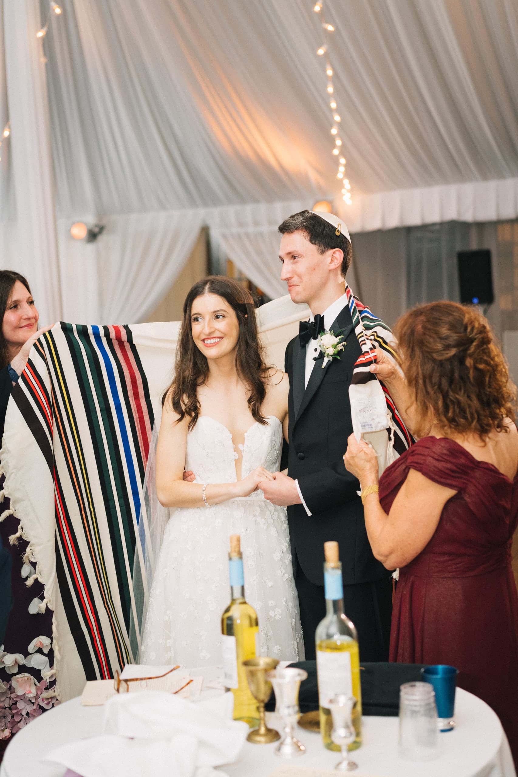 Wrapped together in a striped tallit for the blessing under the tent