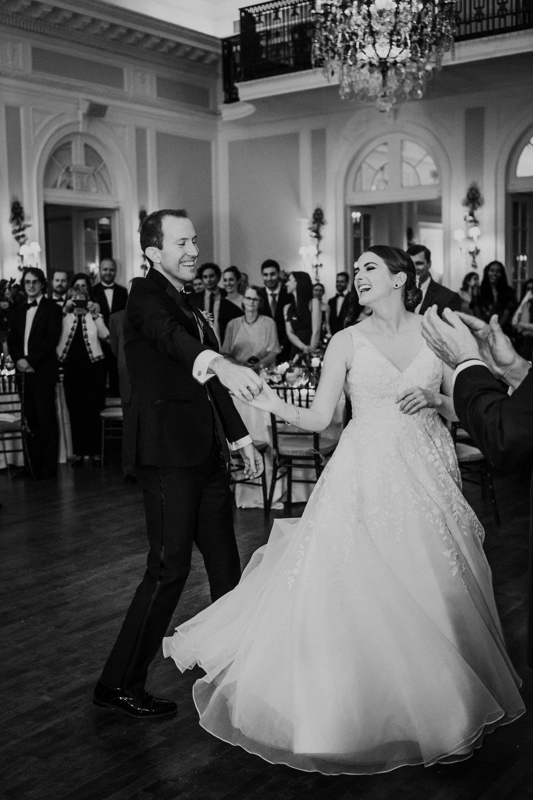 Laughter mid-spin on the ballroom floor, black and white