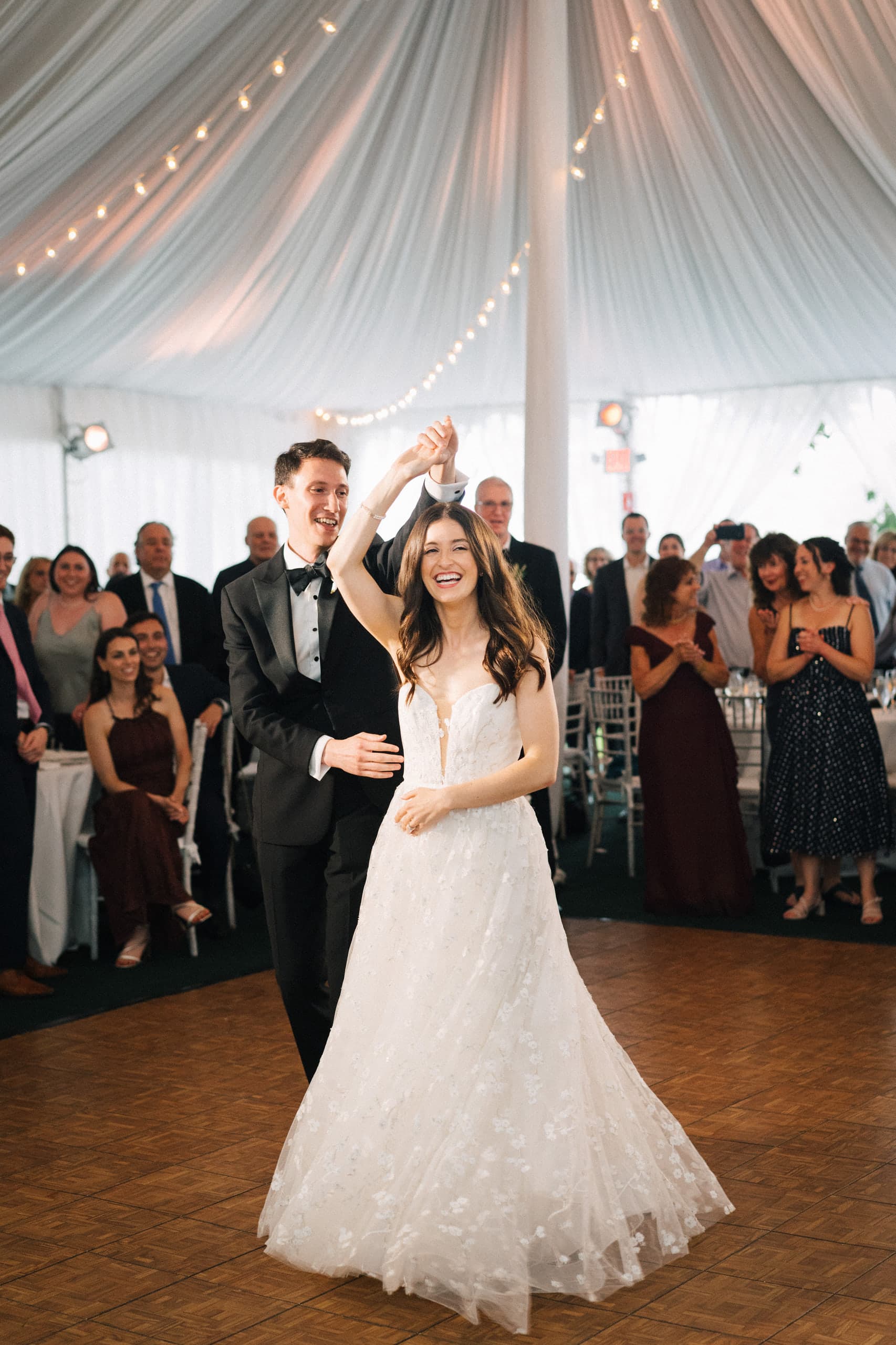 A spin under his arm on the tented dance floor