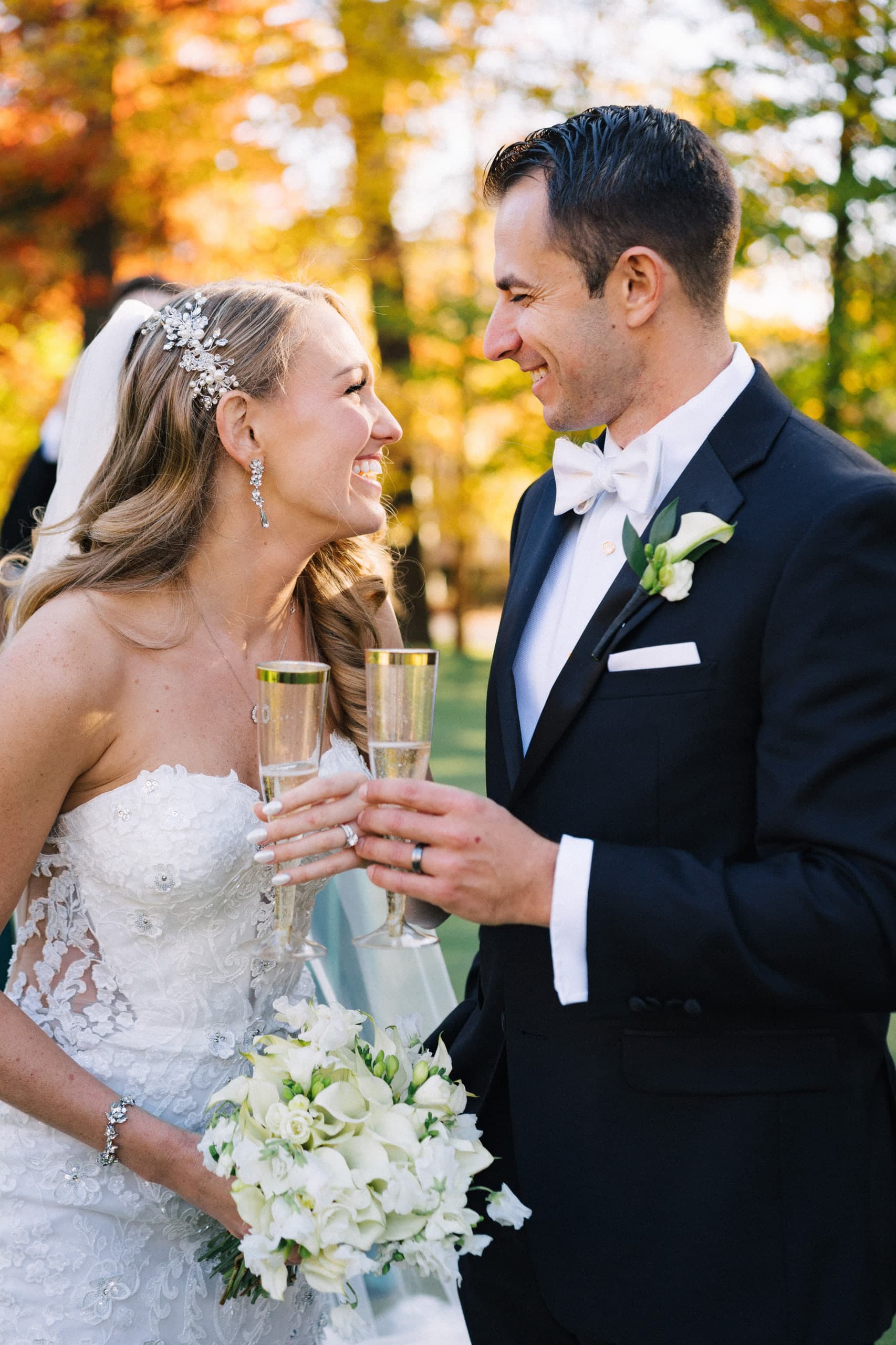 A champagne toast beneath autumn leaves