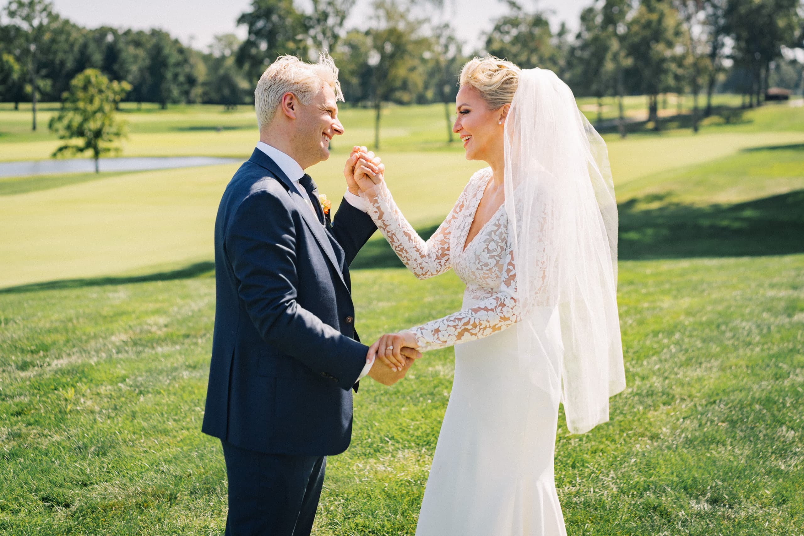 A dance on the green, hands clasped in the midday sun